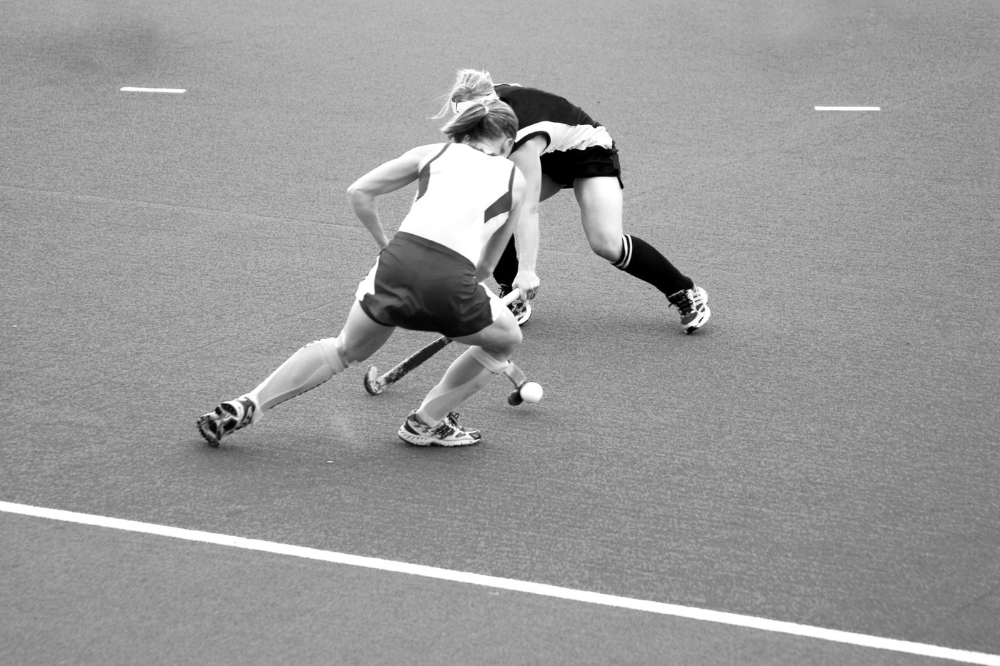 Hockey action — players competing on the pitch